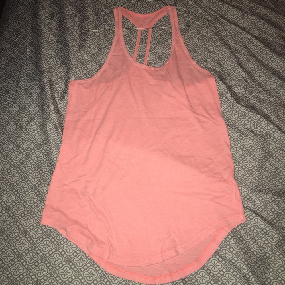 neon pink or peach (not really sure lol) tank top